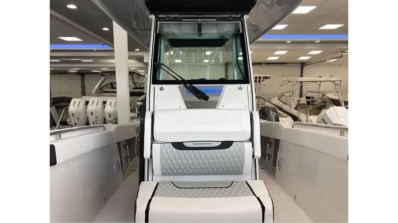 Slide: The Image of 2024 Blackfin 272 CC center console boat interior view in showroom. - 15