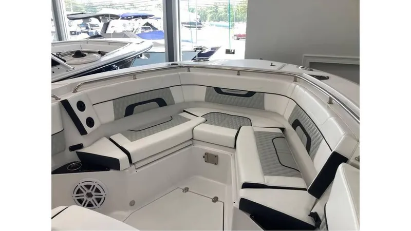 Slide: The Image of 2024 Blackfin 272 CC boat interior with cushioned seating and modern design. - 16