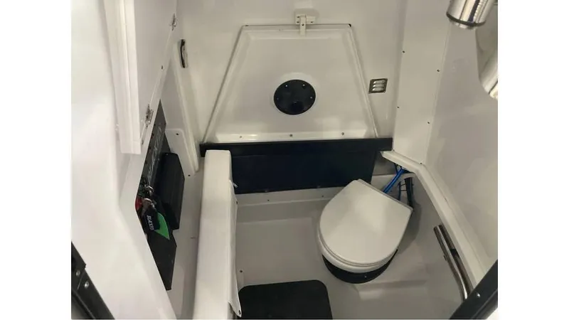 Slide: The Image of 2024 Blackfin 272 CC boat interior cabin with toilet - 17