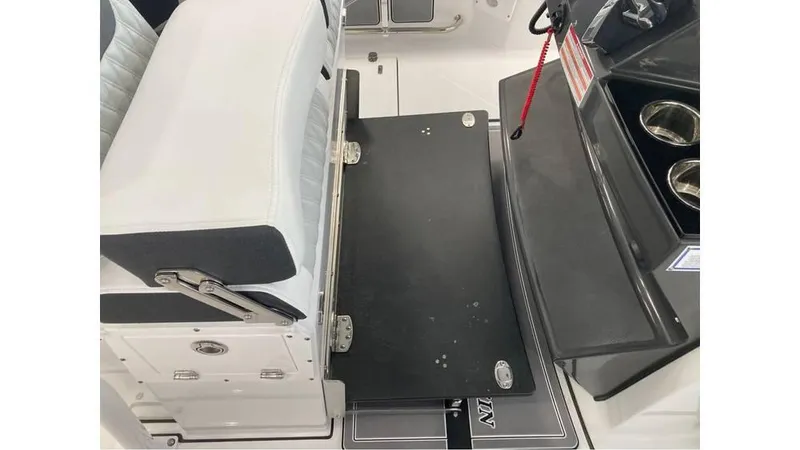 Slide: The Image of 2024 Blackfin 272 CC boat interior seating and storage area. - 19