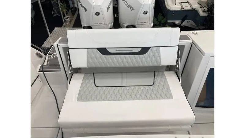 Slide: The Image of 2024 Blackfin 272 CC boat seating with dual Mercury outboard engines. - 22