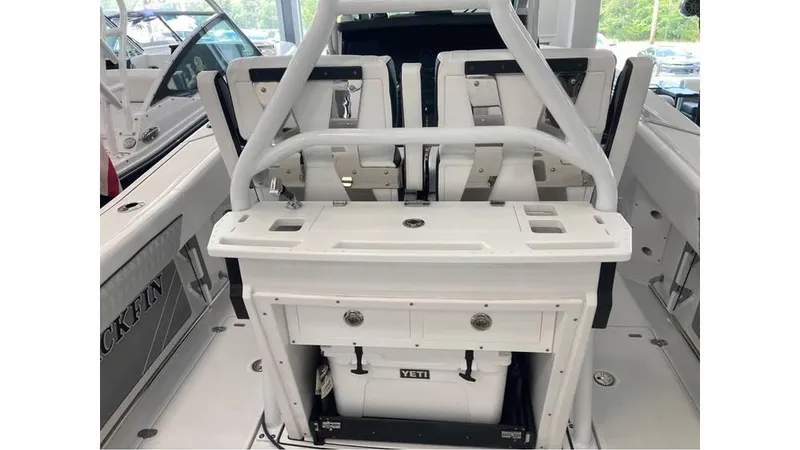 Slide: The Image of 2024 Blackfin 272 CC center console boat interior with seating and Yeti cooler. - 7