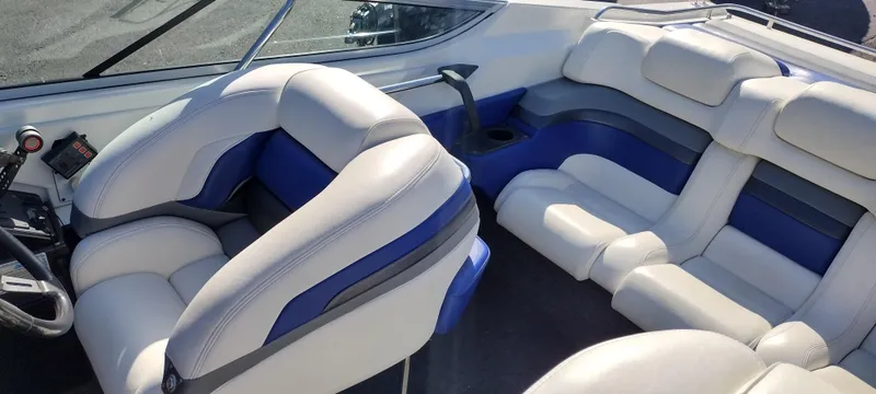 Slide: The Image of 1991 Formula 272 SR1 boat interior with white and blue seating. - 14