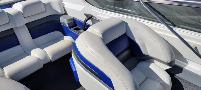 Slide: The Image of Interior of a 1991 Formula 272 SR1 boat with white and blue seating. - 15