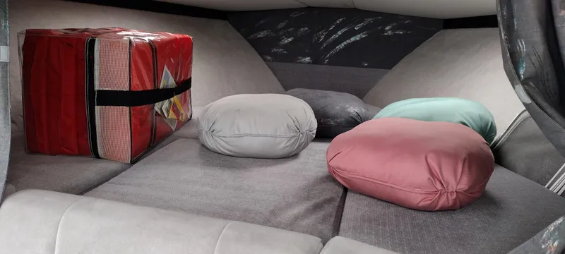 Slide: The Image of Interior cabin of a 1991 Formula 272 SR1 boat with cushions and a red storage box. - 19