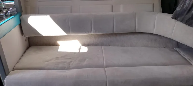 Slide: The Image of Interior seating of a 1991 Formula 272 SR1 boat with grey upholstery. - 20