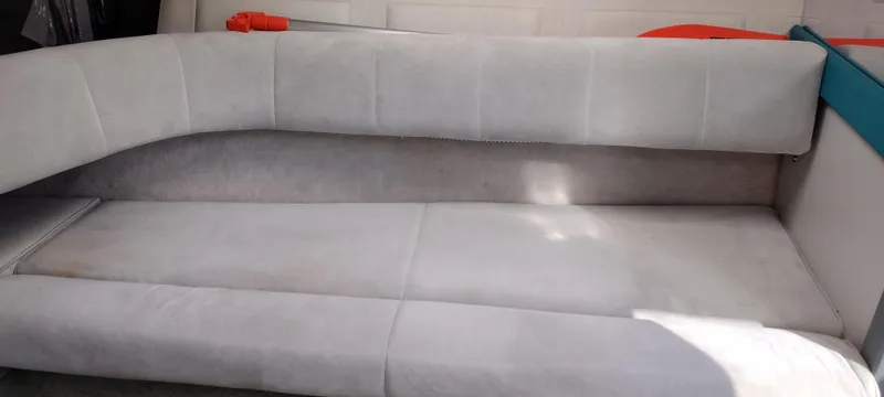 Slide: The Image of 1991 Formula 272 SR1 boat interior with grey cushioned seating. - 21