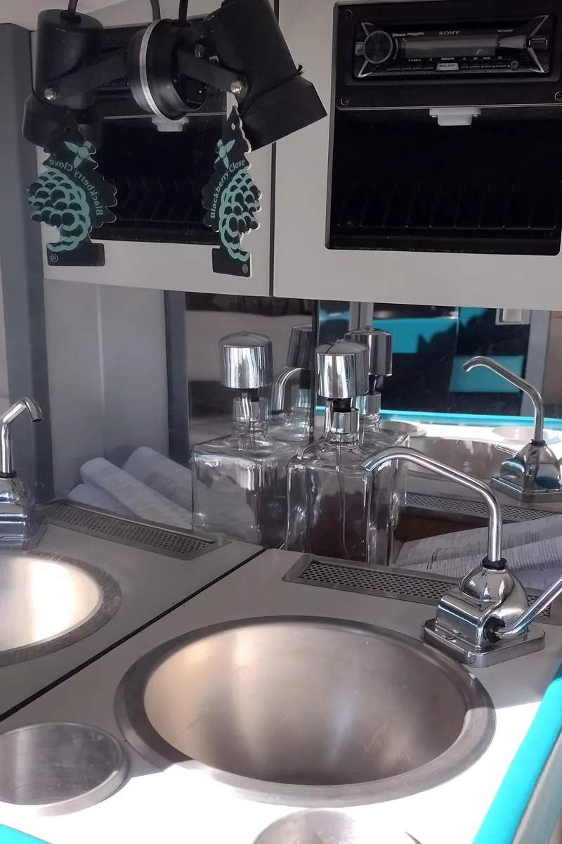 Slide: The Image of 1991 Formula 272 SR1 boat interior with sink, faucet, and storage compartments. - 34