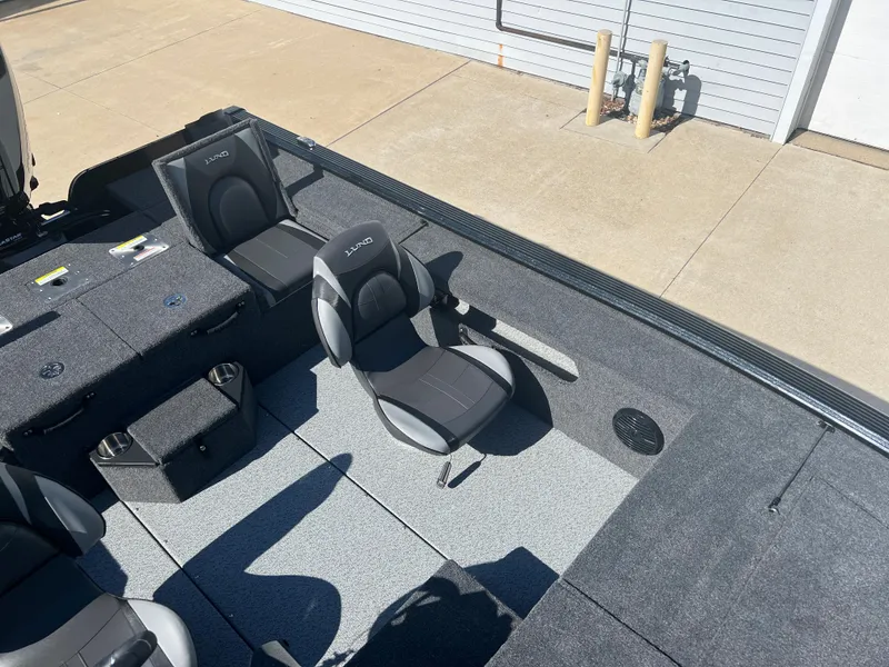 Slide: The Image of 2024 Lund 1875 Pro-V Bass XS boat interior with gray seating and deck. - 16