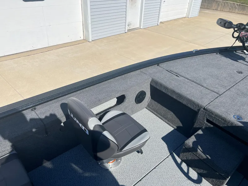 Slide: The Image of 2024 Lund 1875 Pro-V Bass XS boat interior with seating and storage compartments. - 17