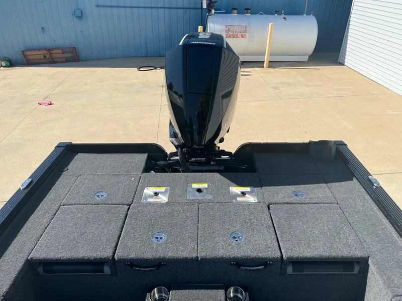 Slide: The Image of 2024 Lund 1875 Pro-V Bass XS boat rear view with motor. - 22