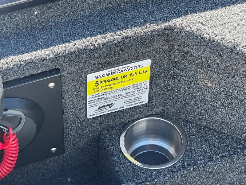 Slide: The Image of 2024 Lund 1875 Pro-V Bass XS boat capacity label and cup holder. - 25