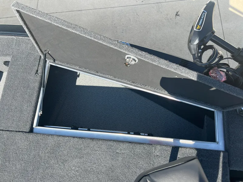 Slide: The Image of Open storage compartment on a 2024 Lund 1875 Pro-V Bass XS boat. - 9
