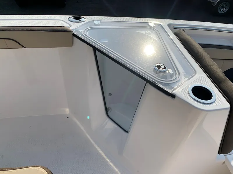 Slide: The Image of 2023 Yamaha Boats 255 FSH Sport E bow storage compartment with cup holders. - 17