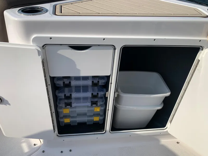 Slide: The Image of Storage compartments on a 2023 Yamaha Boats 255 FSH Sport E. - 18
