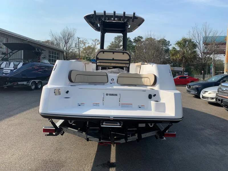 Slide: The Image of 2023 Yamaha Boats 255 FSH Sport E, rear view at dealership. - 7