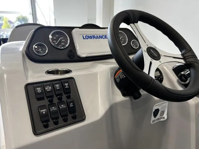 Slide: The Image of 2024 Bentley Pontoons Fish 223 Center Walk-Thru 3/4 Tube dashboard and steering wheel. - 15