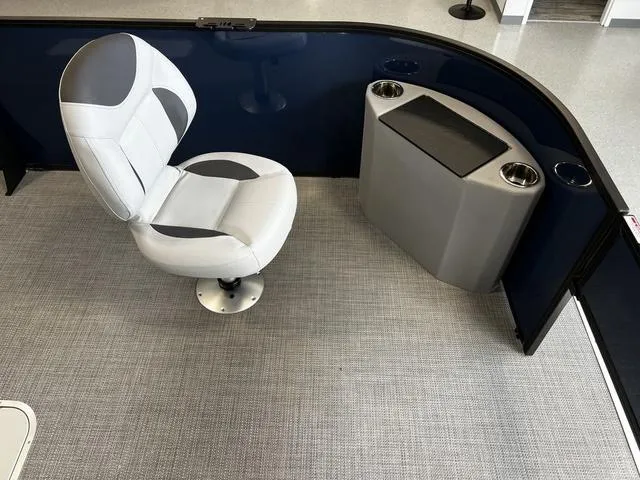 Slide: The Image of 2024 Bentley Pontoons Fish 223 Center Walk-Thru 3/4 Tube interior with captain's chair and console. - 8