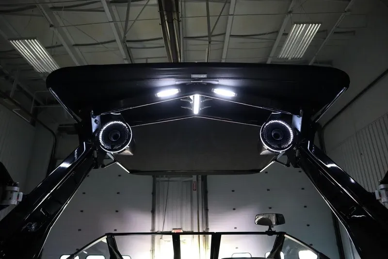 Slide: The Image of 2024 Centurion Ri230 boat interior with illuminated speakers and sleek design. - 10