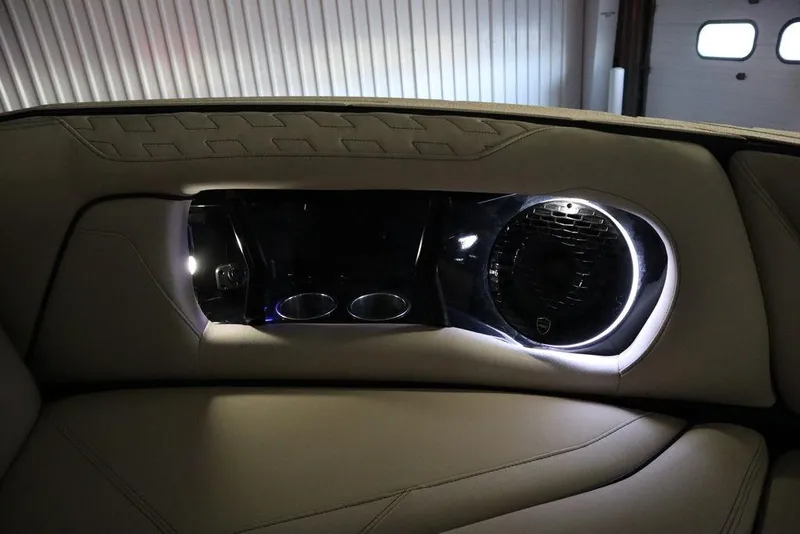 Slide: The Image of 2024 Centurion Ri230 interior with illuminated speaker and cup holders. - 23