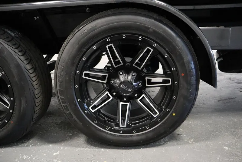 Slide: The Image of 2024 Centurion Ri230 black alloy wheel with sleek design and detailed accents. - 24
