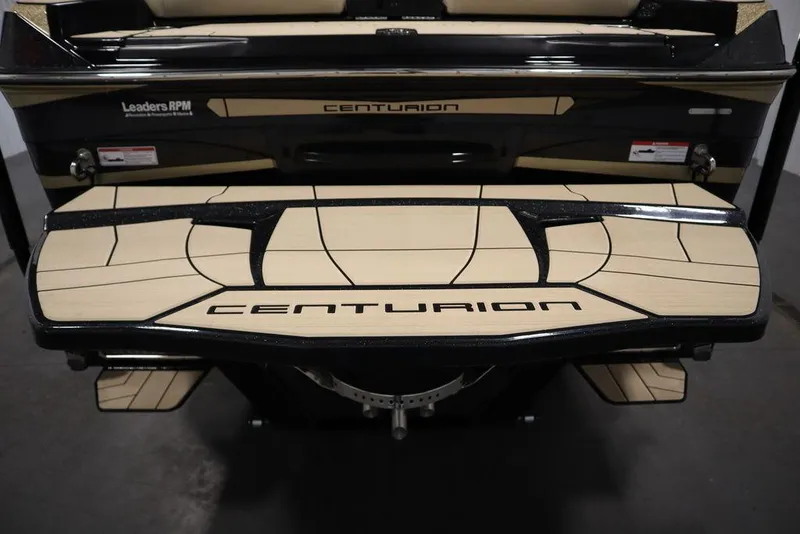 Slide: The Image of 2024 Centurion Ri230 boat rear view with branded deck design. - 31
