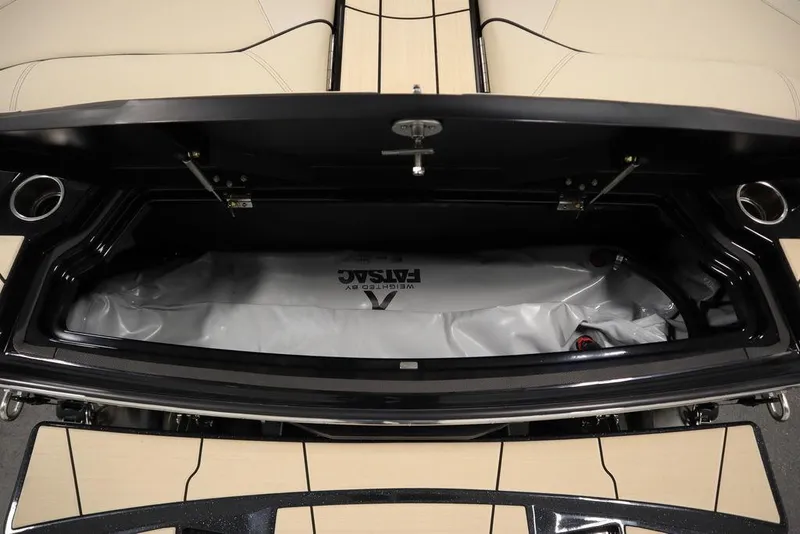 Slide: The Image of 2024 Centurion Ri230 storage compartment with ballast bag, open lid, beige interior. - 34