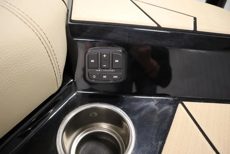 Slide: The Image of 2024 Centurion Ri230 interior with audio controls and cup holder. - 35