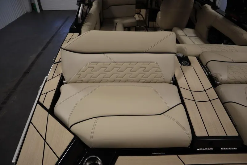 Slide: The Image of 2024 Centurion Ri230 boat interior with beige seating and modern design. - 36