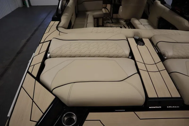 Slide: The Image of 2024 Centurion Ri230 boat interior with beige upholstery and sleek design. - 38