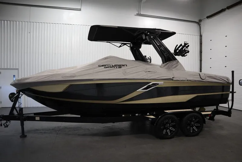 Slide: The Image of 2024 Centurion Ri230 boat with cover in indoor storage. - 4