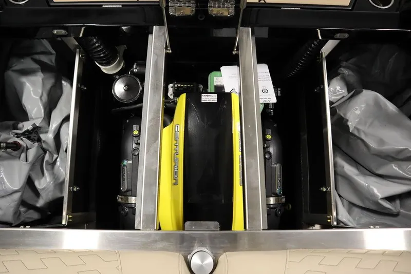 Slide: The Image of 2024 Centurion Ri230 engine compartment with visible components and storage areas. - 40