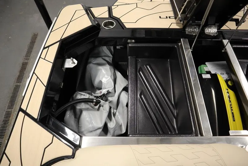 Slide: The Image of 2024 Centurion Ri230 boat storage compartments with equipment and accessories. - 41