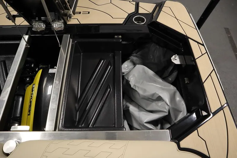 Slide: The Image of 2024 Centurion Ri230 boat interior storage compartment with sleek design and modern features. - 42