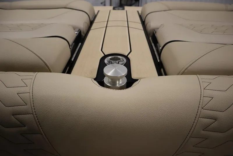 Slide: The Image of 2024 Centurion Ri230 boat interior with beige leather seating and sleek design. - 45