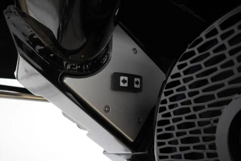 Slide: The Image of Close-up of 2024 Centurion Ri230 boat component with control buttons. - 47