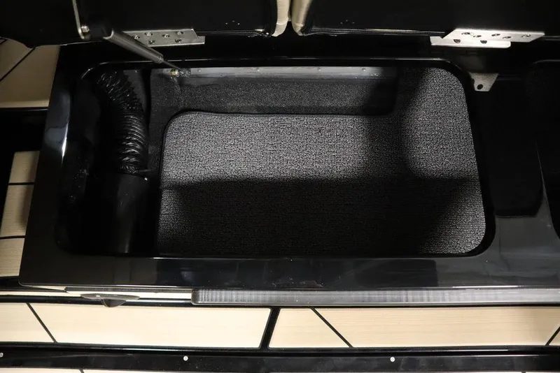 Slide: The Image of 2024 Centurion Ri230 storage compartment with black interior and sleek design. - 52