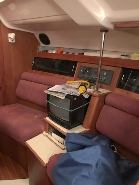 Slide: The Image of Interior of 1987 Hunter Legend 37 sailboat with seating and vintage TV. - 16