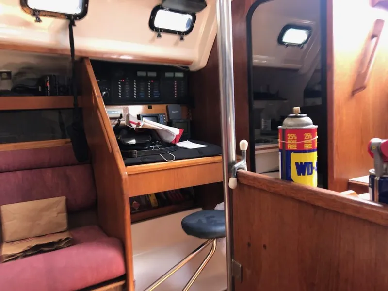 Slide: The Image of Interior of 1987 Hunter Legend 37 sailboat with navigation station and seating. - 21