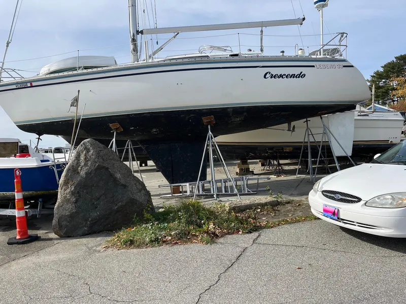 Slide: The Image of 1987 Hunter Legend 37 sailboat Crescendo on stands in a boatyard. - 7