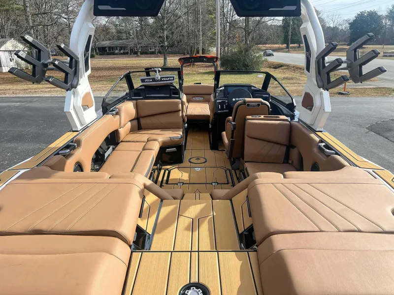 Slide: The Image of 2024 Supra SA boat interior with tan leather seating and modern design. - 10