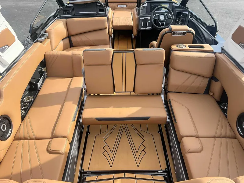 Slide: The Image of 2024 Supra SA boat interior with luxurious tan leather seating and modern dashboard design. - 19