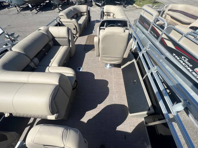 Slide: The Image of 2024 Sun Tracker SportFish 22 XP3 pontoon boat interior with beige seating. - 3