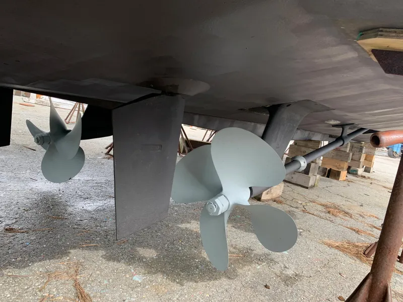 Slide: The Image of Propellers and rudders of a 1998 Viking 60 CMY yacht on dry dock. - 15