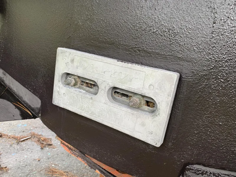 Slide: The Image of 1998 Viking 60 CMY boat zinc anode on hull for corrosion protection. - 19