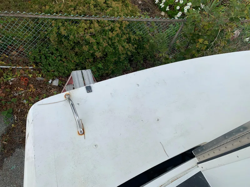 Slide: The Image of Top view of a 1998 Viking 60 CMY boat deck near a fence. - 21