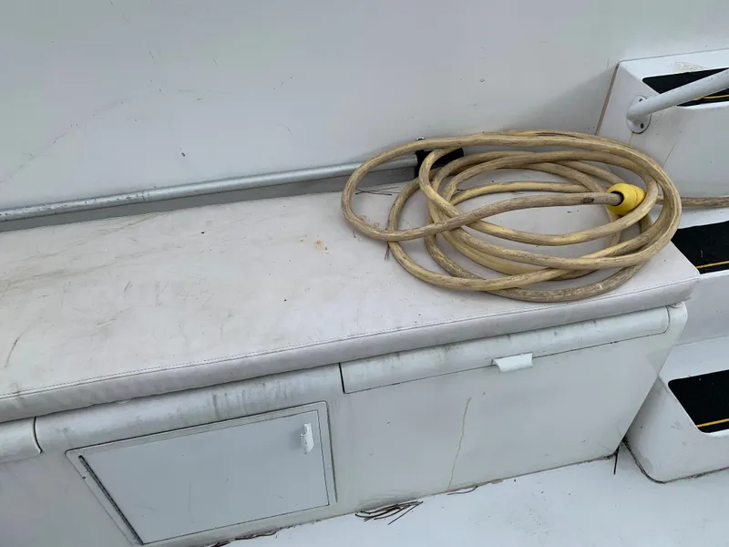 Slide: The Image of Coiled rope on a Viking 60 CMY 1998 boat bench. - 25