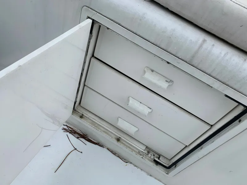 Slide: The Image of Open storage compartment with drawers on a 1998 Viking 60 CMY yacht. - 27