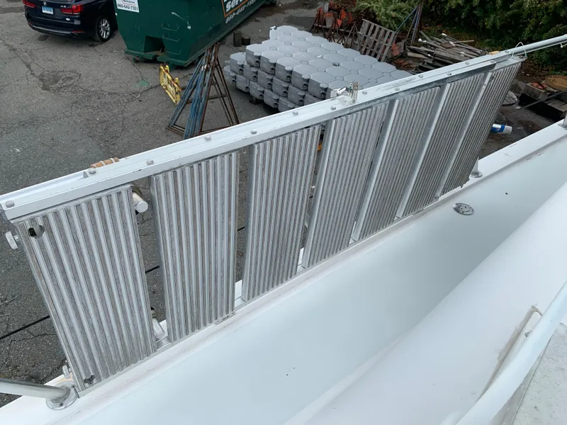 Slide: The Image of Viking 60 CMY 1998 yacht with metal railings and dockside view. - 32