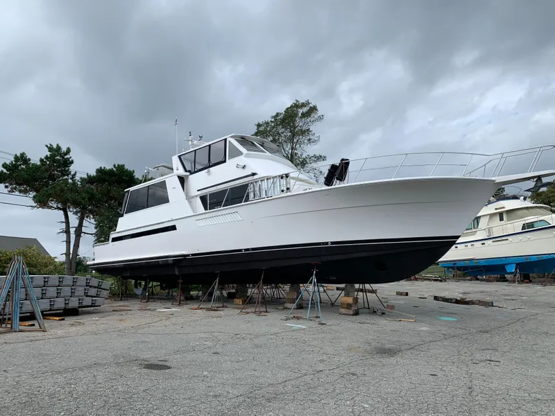 Slide: The Image of 1998 Viking 60 CMY yacht on dry dock under cloudy sky. - 4